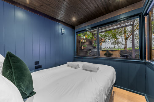 the mad house luxury glamping at wonderland retreats lancashire bed view