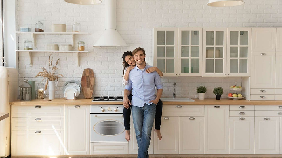 Happy Couple in a white kitchen with wood countertops