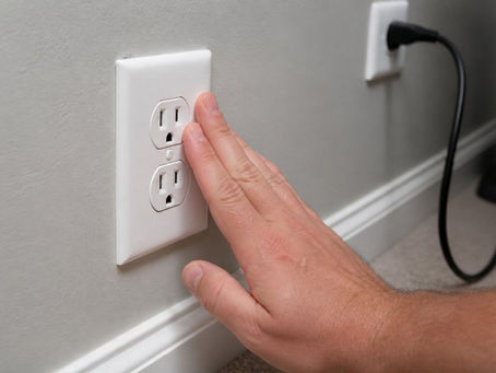 Why Do My Outlets Feel Warm? Causes & Fixes