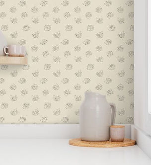 An image of a corner wallpapered in a hedgehog design with a white jug in front.