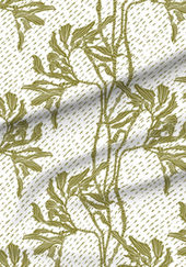 A slightly creased piece of fabric featuring an elegant duotone design of sea kelp fronds in a blockprint style.