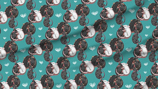 A slightly creased piece of fabric featuring rats tumbling about and cuddling each other.