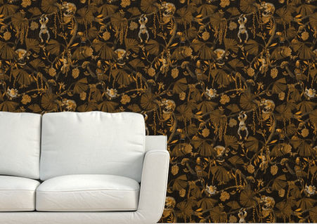A slightly creased piece of fabric featuring a moody trailing jungle design by lenes_linien with monkeys, birds, chameleons and butterflies.