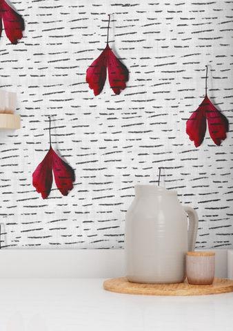 A slightly creased piece of fabric featuring falling deep red ginkgo leaves on a white textured ground with charcoal lines by lenes_linien.