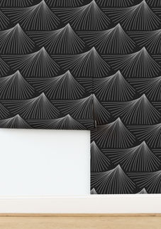 A slightly creased piece of fabric featuring abstract faux-embroidery mountaintops in white and gray on a black field by lenes_linien.