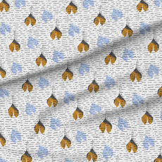 A slightly creased piece of fabric featuring falling ginkgo leaves in golden brown and pale blue with dark gray accents by lenes_linien.