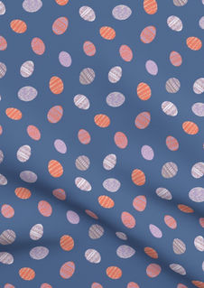 A slightly creased piece of fabric featuring tossed small decorated easter eggs.