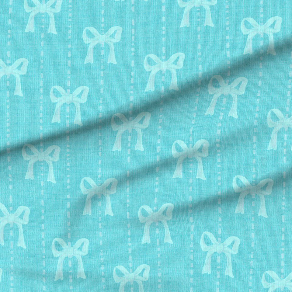 A slightly creased piece of fabric featuring a design  of light aquamarine hand-drawn bows on turquoise by lenes_linien