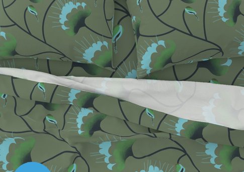 A slightly creased piece of fabric showing elegant art nouveau fantasy flowers in earthy green and blue hues.