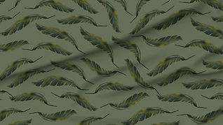 A slightly creased piece of fabric featuring the described banana leaf design by lenes_linien.
