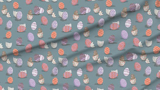 A slightly creased piece of fabric featuring the described easter bunny and egg shells design.