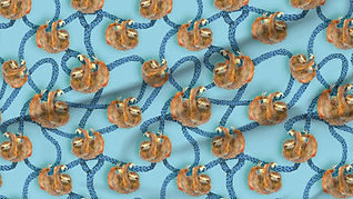 A slightly creased piece of fabric featuring the described design of hand-drawn sloths hanging on lianas.