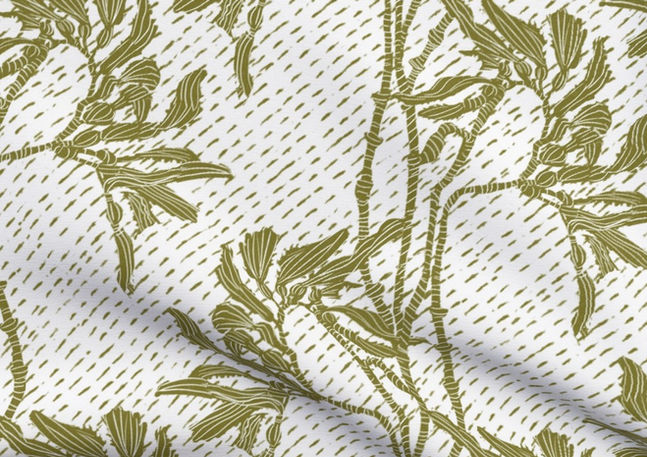A slightly creased piece of fabric featuring an elegant duotone design of sea kelp fronds in a blockprint style.