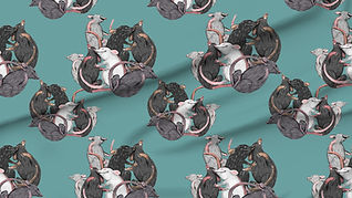 A slightly creased piece of fabric featuring rats tumbling about and cuddling each other.