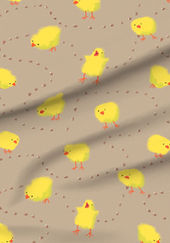 A slightly creased piece of fabric featuring fluffy yellow chicks and scattered corn kernels on a warm taupe background by lenes_linien.