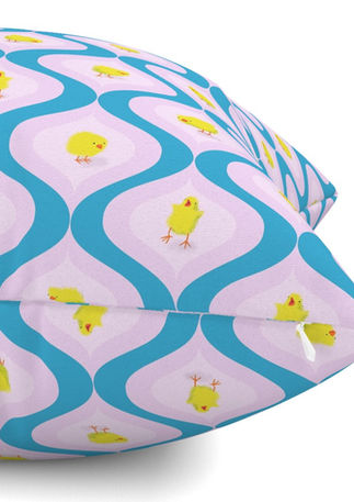 A slightly creased piece of fabric featuring yellow chicks in colorful retro ogee shapes by lenes_linien.