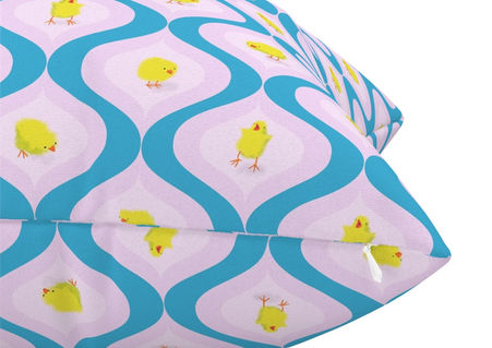 A slightly creased piece of fabric featuring yellow chicks in colorful retro ogee shapes by lenes_linien.
