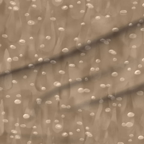 A slightly creased piece of fabric featuring a dynamic, abstract design of air bubbles and drop shapes forming a precious liquid, hand-drawn by lenes_linien