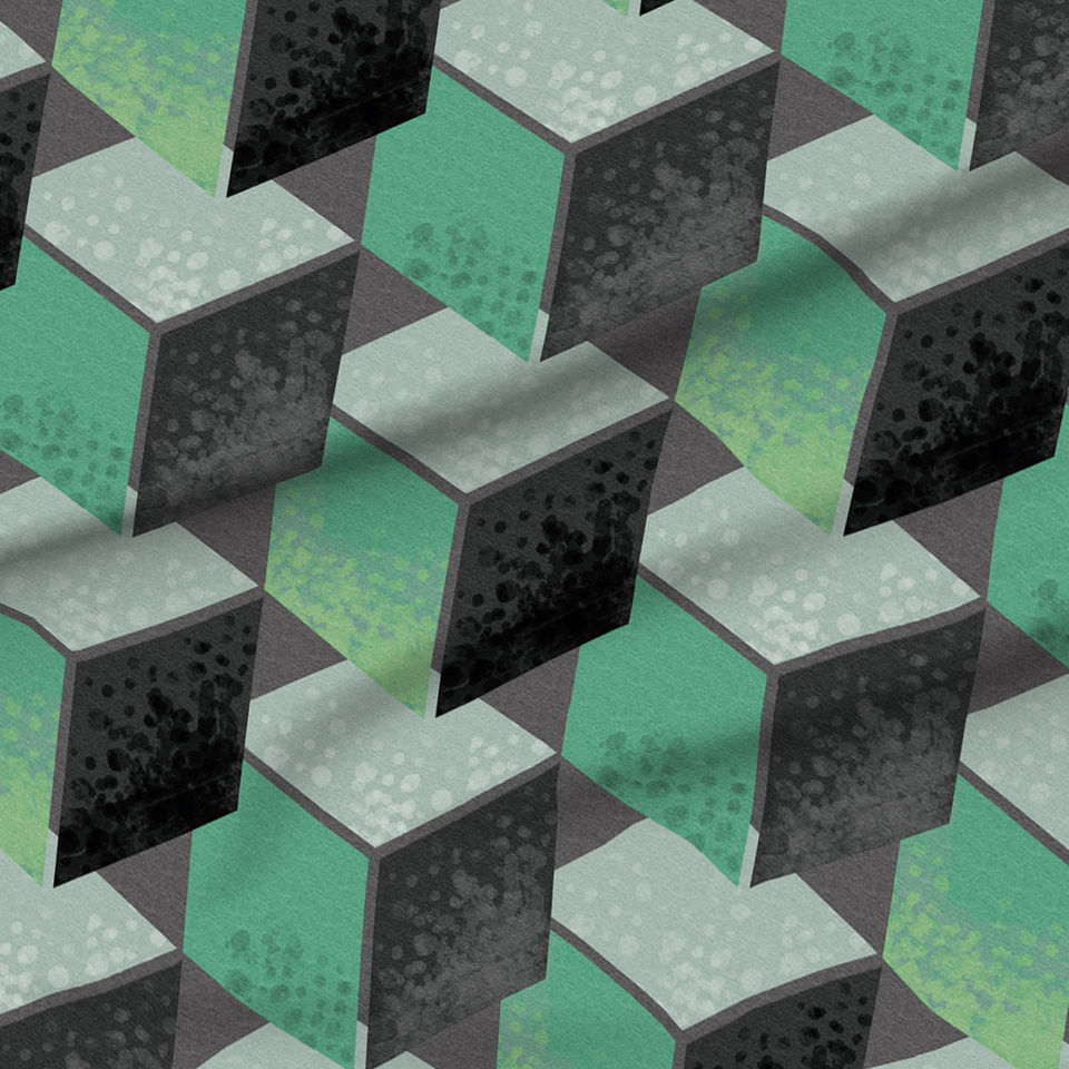 A slightly creased piece of fabric featuring a design of floating geometric cubes in soothing spring greens by lenes_linien