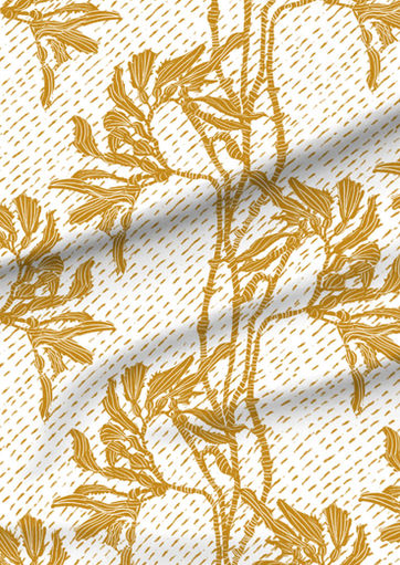A slightly creased piece of fabric featuring an elegant duotone design of sea kelp fronds in a blockprint style.