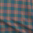 A slightly creased piece of fabric featuring a modern tartan design by lenes_linien.