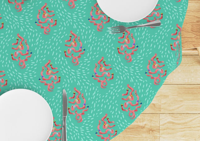 A slightly creased rectangle of fabric showing a lenes_linien design of fun ogee-shaped clusters of characterful earthworms on a dashed background.