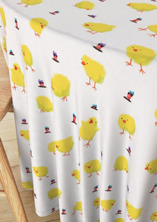 A slightly creased piece of fabric featuring yellow baby chicks and colorful earthworms with sunglasses by lenes_linien.
