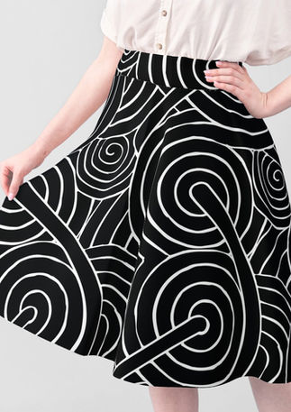 A slightly creased piece of fabric featuring a design of interlocking, sophisticated textured spirals by lenes_linien