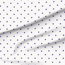 A slightly creased piece of fabric featuring a simple design of slightly irregular blue polka dots on white by lenes_linien