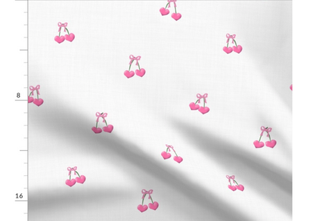 A slightly creased piece of fabric featuring the described heart-shaped cherries design by lenes_linien
