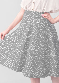 A slightly creased piece of fabric featuring scattered white dashes on a cool gray ground by lenes_linien.