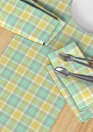 A slightly creased piece of fabric featuring a modern tartan design by lenes_linien.