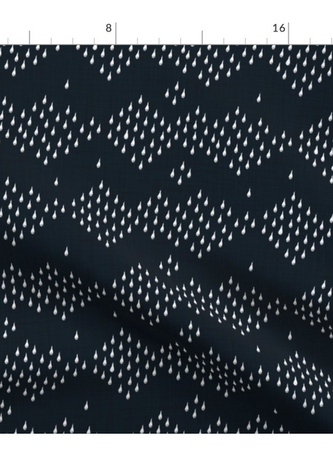 A slightly creased piece of fabric featuring the described geometric raindrop design by lenes_linien