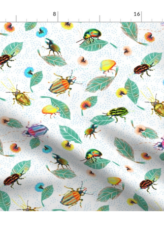 A slightly creased rectangle of fabric showing colorful bugs against pristine white background structured by light blue clustered dots.