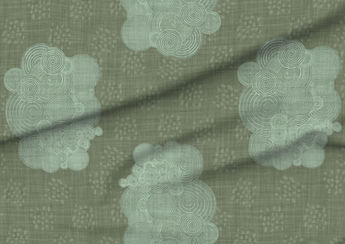 A slightly creased piece of fabric featuring a design of antique scrolls or spirals and clustered dots on jade green, textured faux-linen ground by lenes_linien