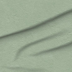 A slightly creased piece of fabric featuring a dusty sage green textured solid by lenes_linien.