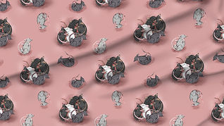 A slightly creased piece of fabric featuring rats tumbling about and cuddling each other.