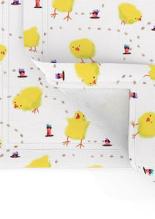 A slightly creased piece of fabric featuring fluffy yellow baby chicks and earthworms with sunglasses on a white ground by lenes_linien.