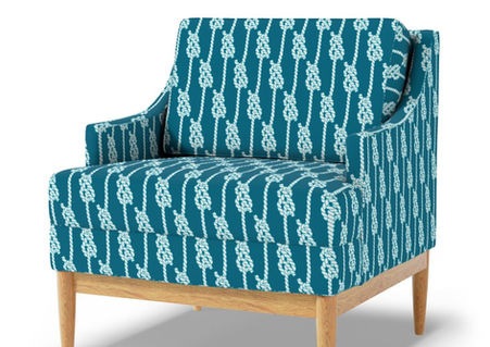 A slightly creased piece of fabric featuring vertical ropes and maritime knots in white against a deep teal background by lenes_linien.