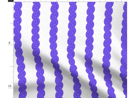 A slightly creased piece of fabric featuring a design of undulating wavy columns textured with squiggles in blue and white by lenes_linien