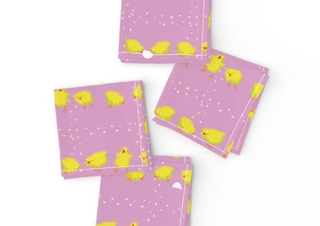 A slightly creased piece of fabric featuring a design of yellow tiny chicklets picking a grid formed of kernels by lenes_linien