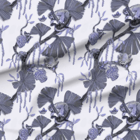 A slightly creased piece of fabric featuring a lush jungle foliage and animals design in blue and white by lenes_linien