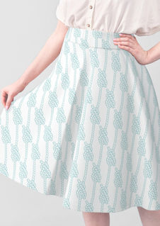 A slightly creased piece of fabric featuring vertical ropes and maritime knots by lenes_linien.