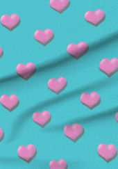 A slightly creased piece of fabric featuring a design of little regularly spaced pink hearts on turquoise by lenes_linien