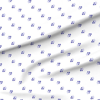 A slightly creased piece of fabric featuring a design of tesselating abstracted blueberries and leaves in blue and white by lenes_linien