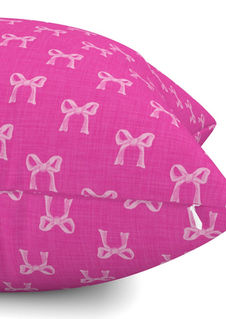 A slightly creased piece of fabric featuring a design  of light rose hand-drawn bows on pink by lenes_linien