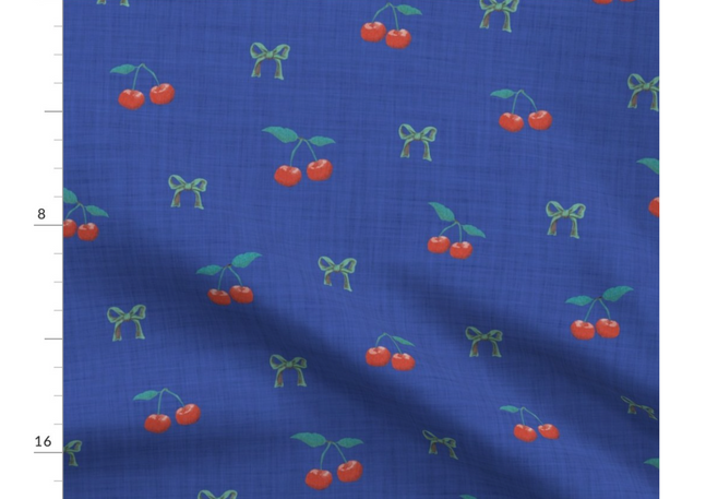A slightly creased piece of fabric featuring a design of red cherries with green stems on dark blue texture by lenes_linien