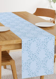 A slightly creased rectangle of fabric showing a trellis or lattice design of ogee-shaped clusters of pebbles on a unicolored background by lenes_linien.