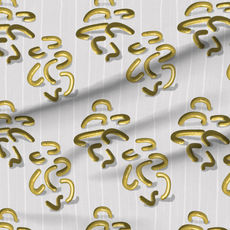 A slightly creased piece of fabric showing golden metal-like squiggle shapes on light striped linen.