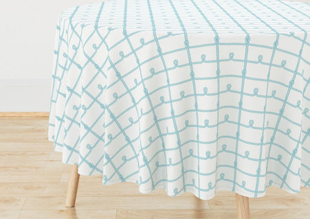 A slightly creased piece of fabric featuring a grid of teal blue ropes with knots by lenes_linien.